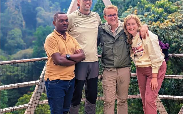 On the canopy walkway, high above the Nyungwe rainforest — Volcano Peaks Safaris Rwanda guests