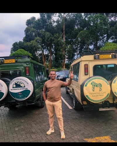 Vehicles ready before an early morning departure — Volcano Peaks Safaris Rwanda guests