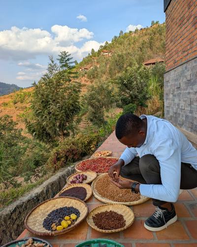 Coffee, beans and spices laid out on a hillside farm visit — Volcano Peaks Safaris Rwanda guests