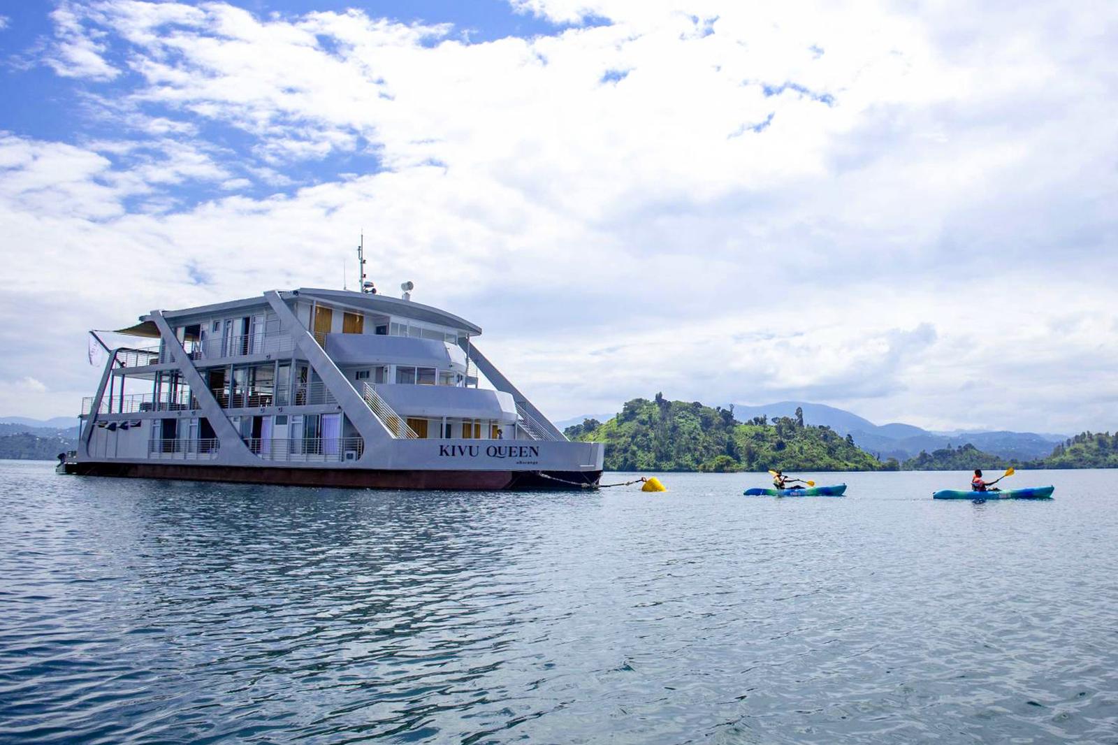 Kivu Queen and kayakers, Lake Kivu